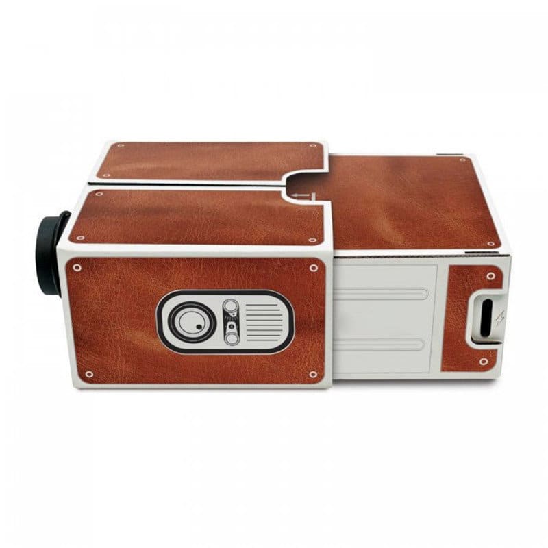 A cardboard smartphone projector with a brown leather-like exterior, featuring a lens and control panel. Cardboard Smart Phone Projector - Image 1