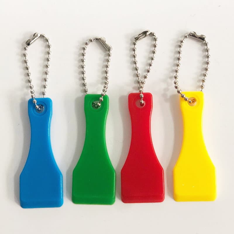 A set of four lottery scratcher keychains in blue, green, red, and yellow, attached to silver chains. Lottery Scratcher Keychain - Image 1